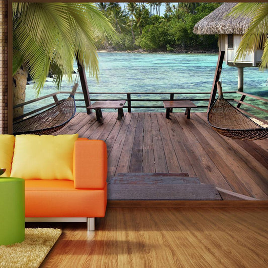 Fotobehang - Tropical Landscape - Turquoise water with palm trees and wooden cottages